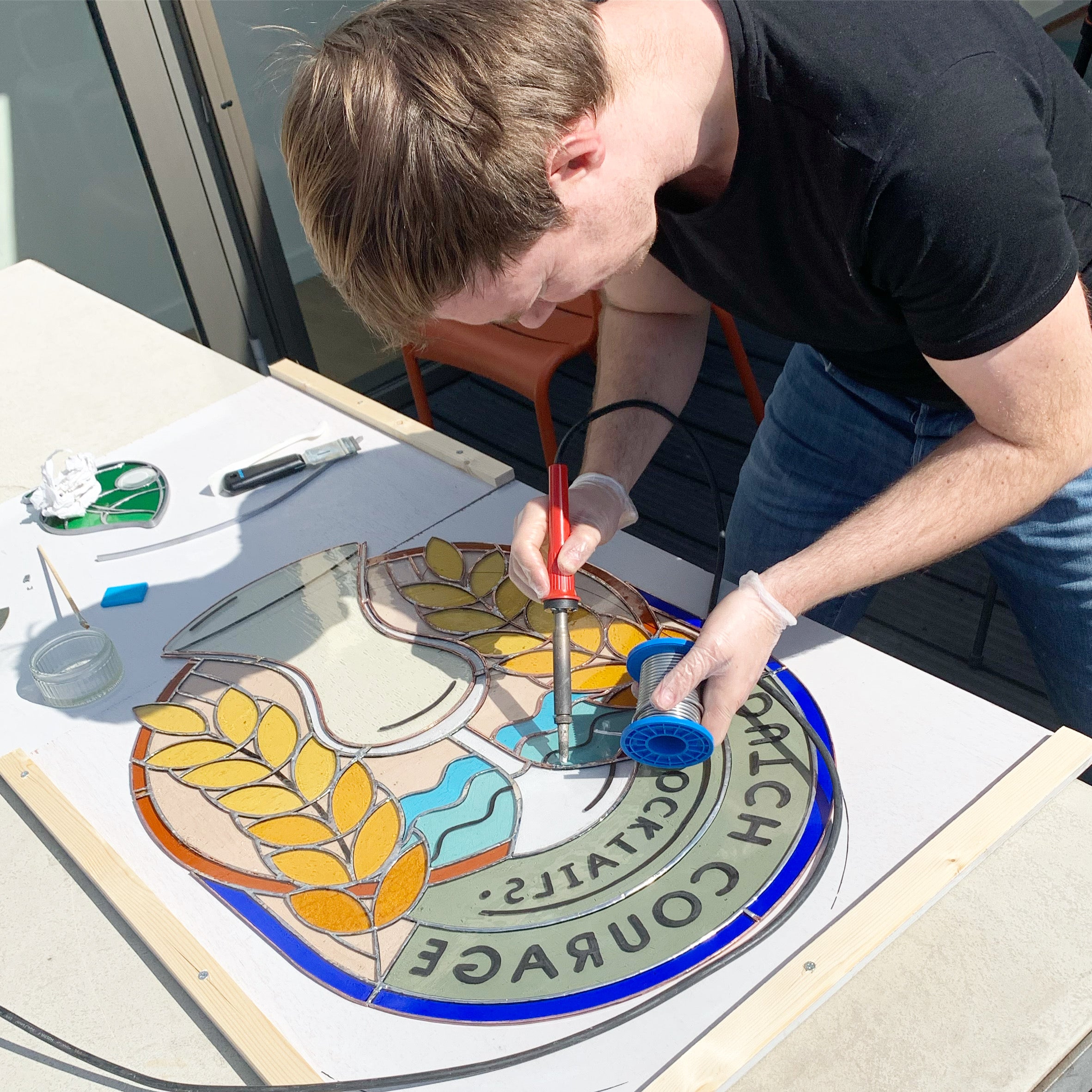 stained glass geek working on a commissioned piece, a collaboration with the dutch cocktailbar Dutch Courage by Tess Posthumus en Timo Janse