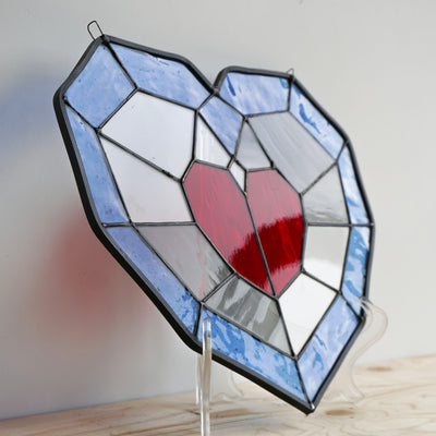 piece of heart stained glass angled view