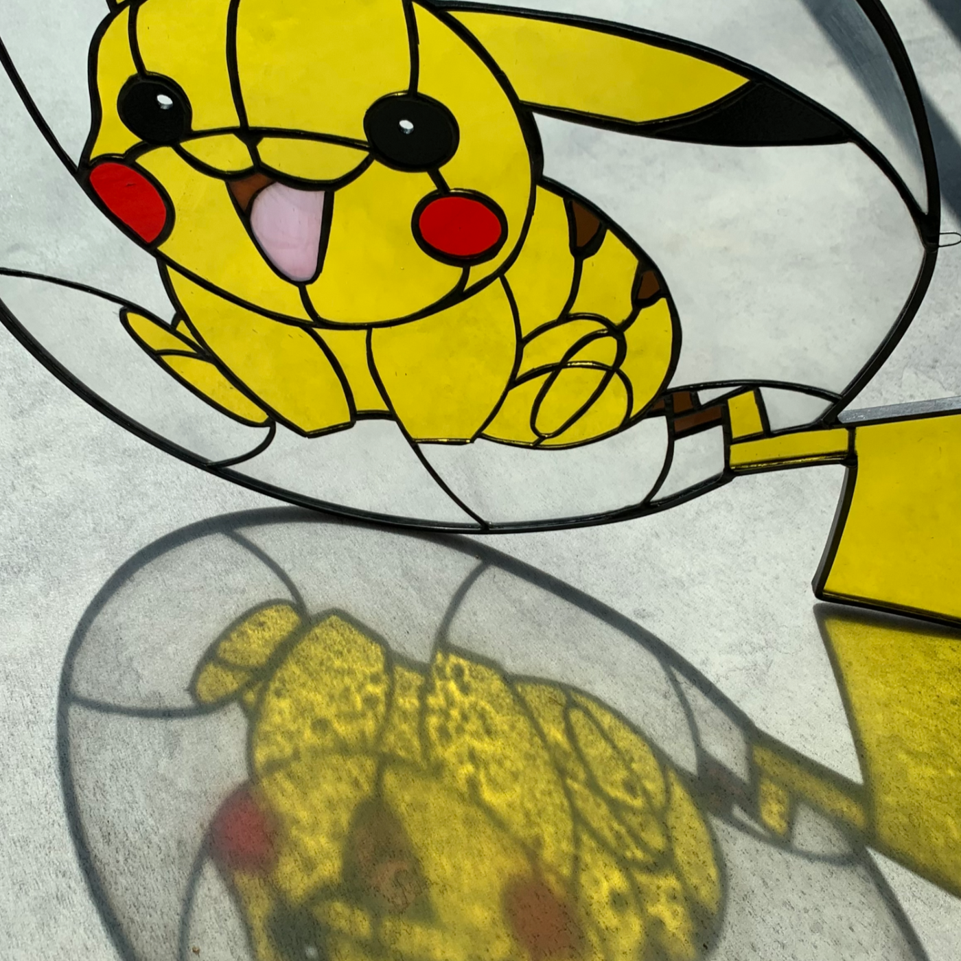 light shines through pikachu round stained glass suncatcher